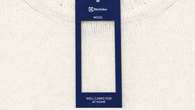 Pull blanc en laine séché en machine Electrolux. Un soin méritant son label.