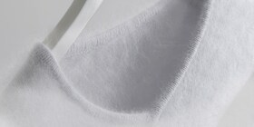 Een witte wollen trui