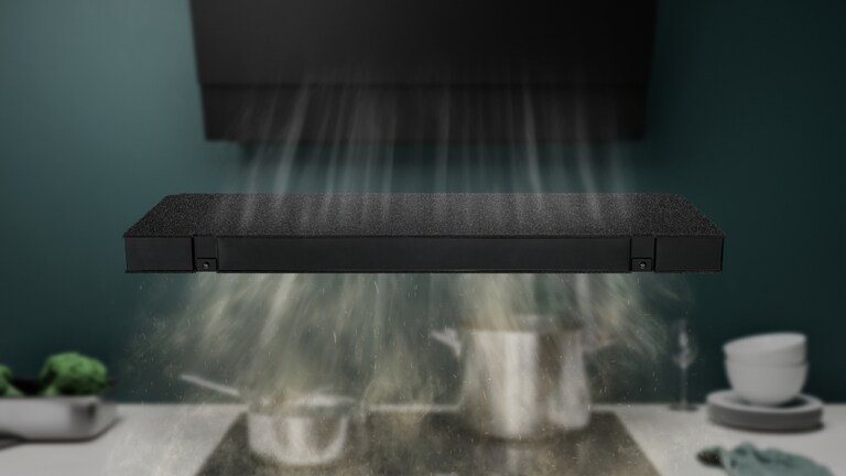 AEG carbon filter absorbing cooking odours from kitchen hob.